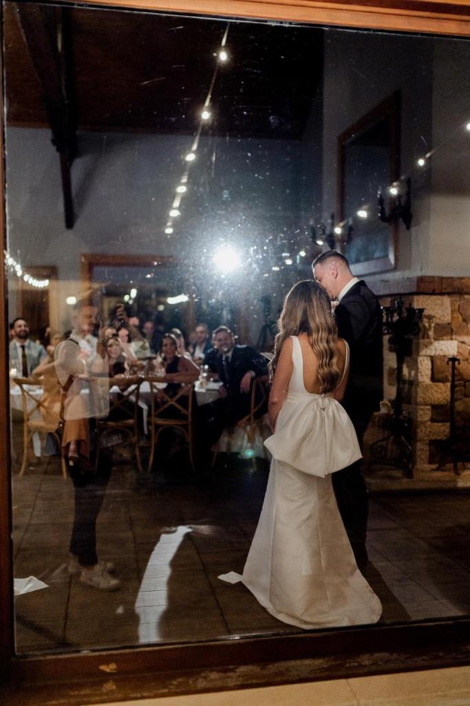 Bride and groom under spotlight