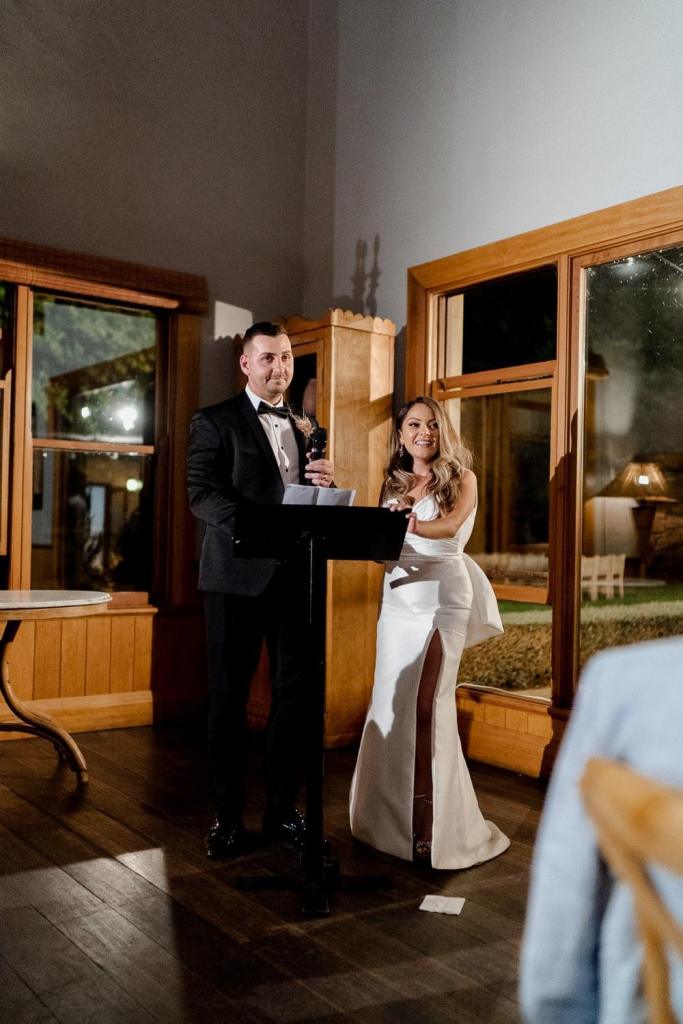 Bride and groom giving speech