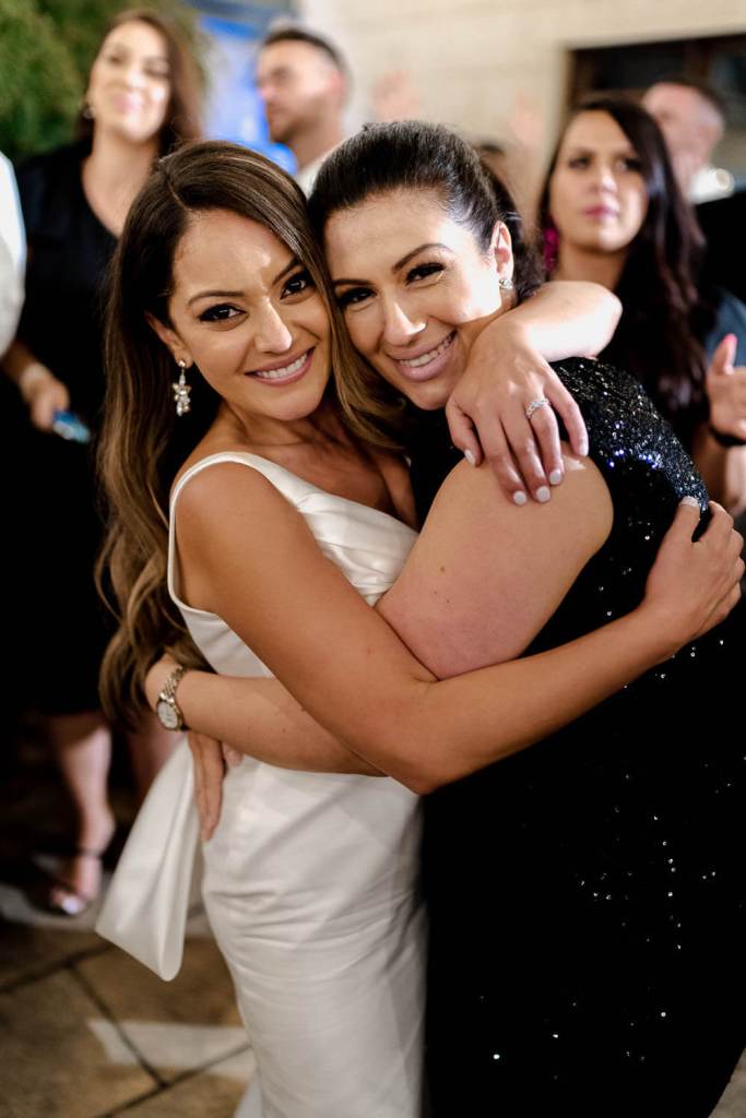 Bride smiling with guest