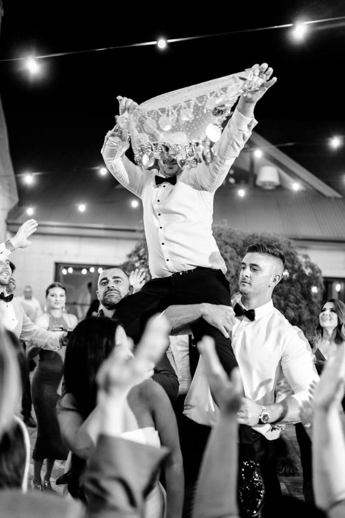 groom dancing with traditons