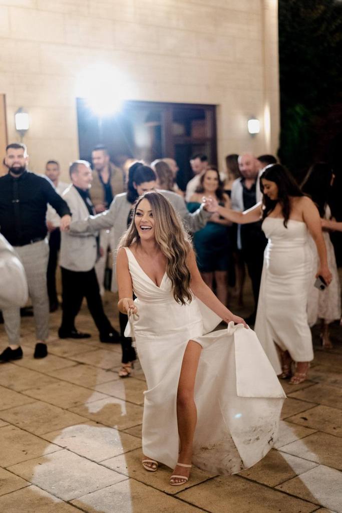 Bride dancing with groom