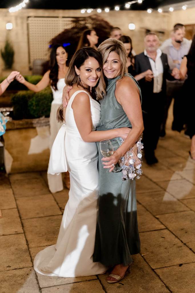 Bride smiling with guest