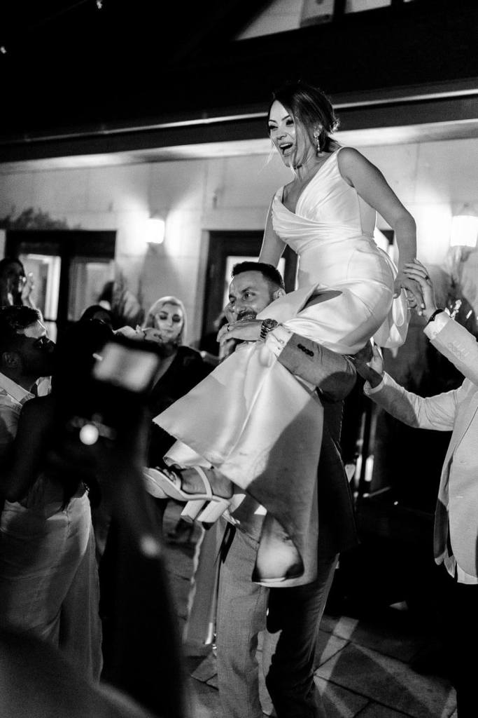 bride on guest shoulders