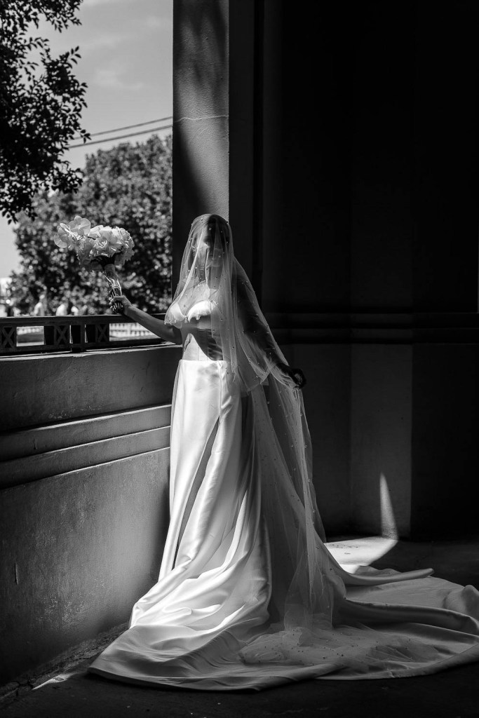 bride resting with flowers black and white
