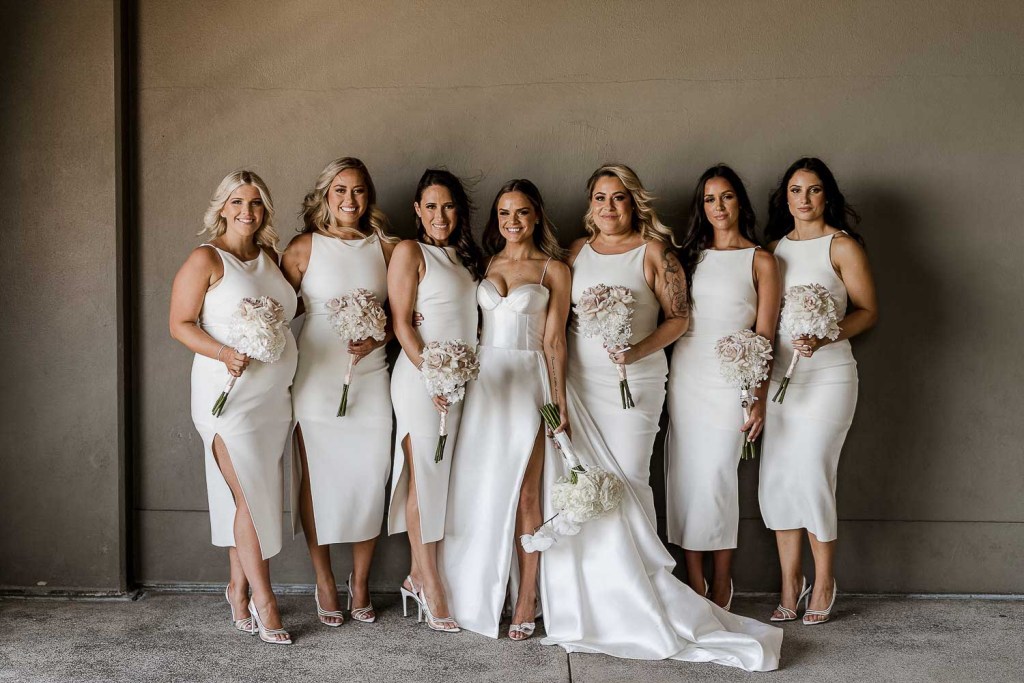 bridesmaids smiling at camera