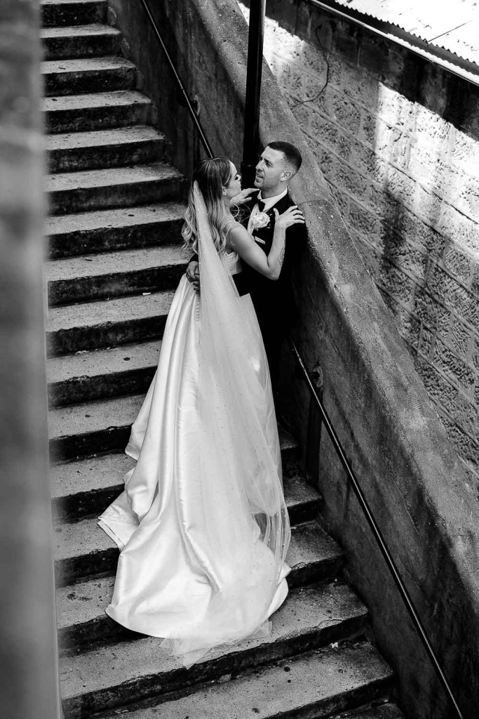 couple on stairs black and white