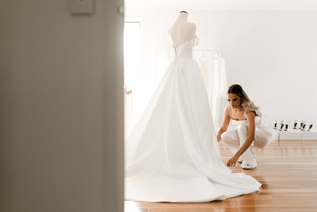 bride fixing dress