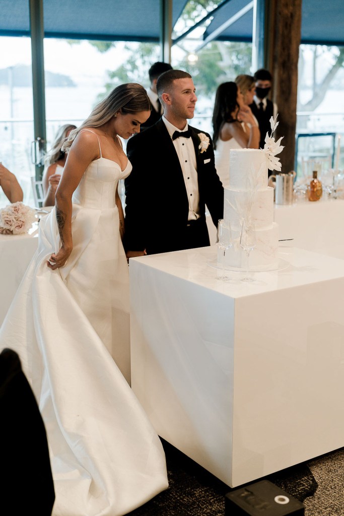couple cutting cake