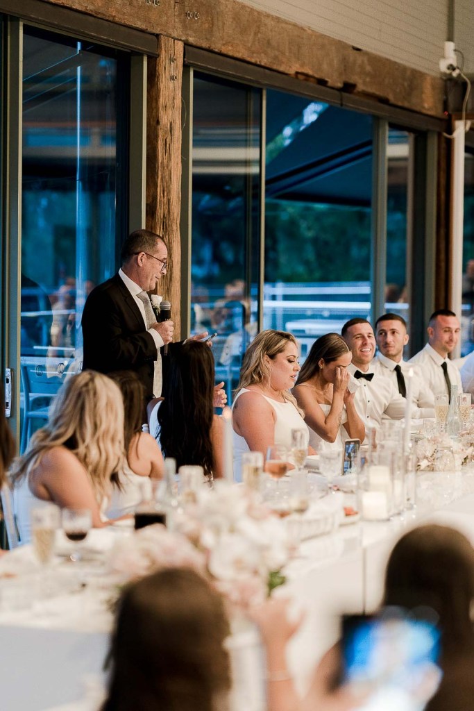 man giving speech and people crying