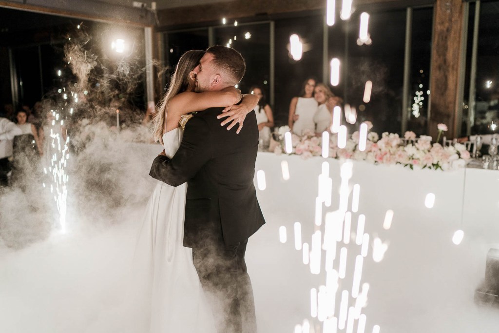 couple hug in smoke and fireworks
