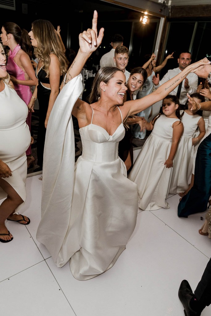 bride cheering on dancefloor