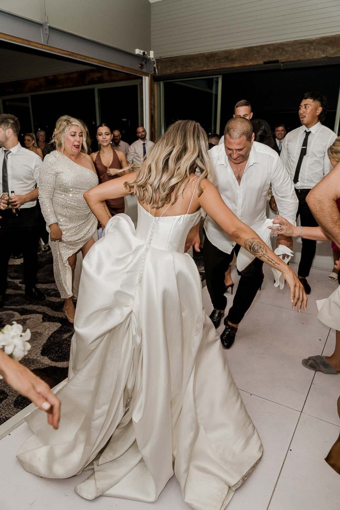 bride dancing back of dress