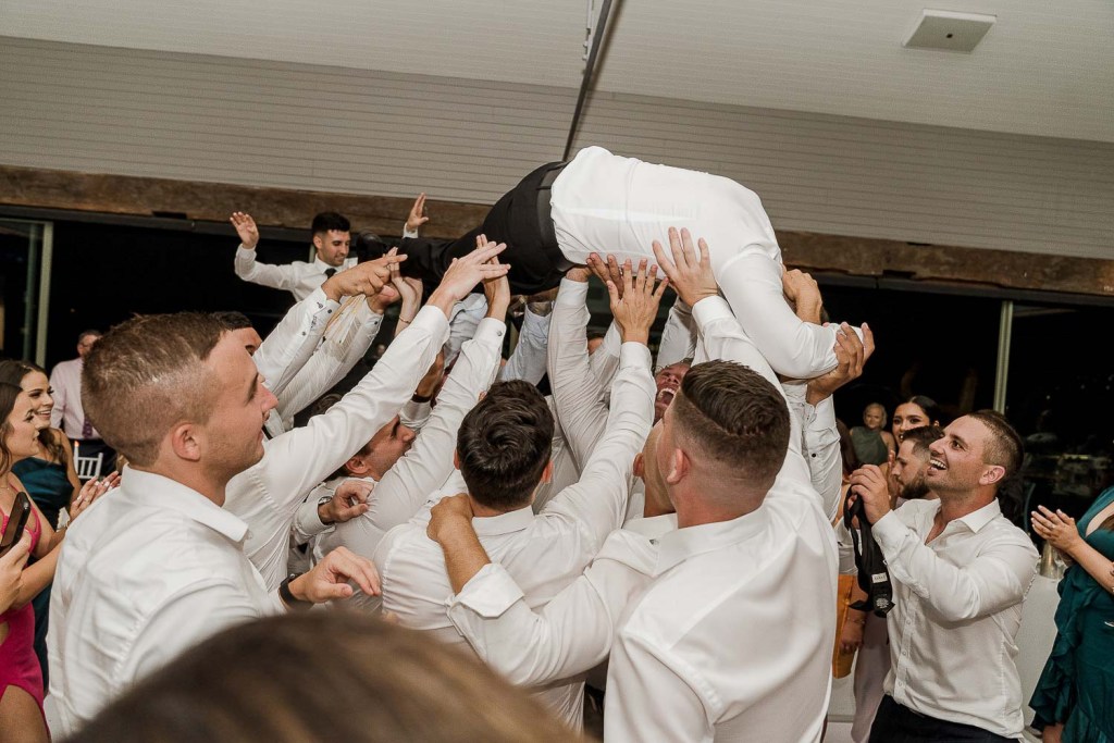 man stage dives into crowd