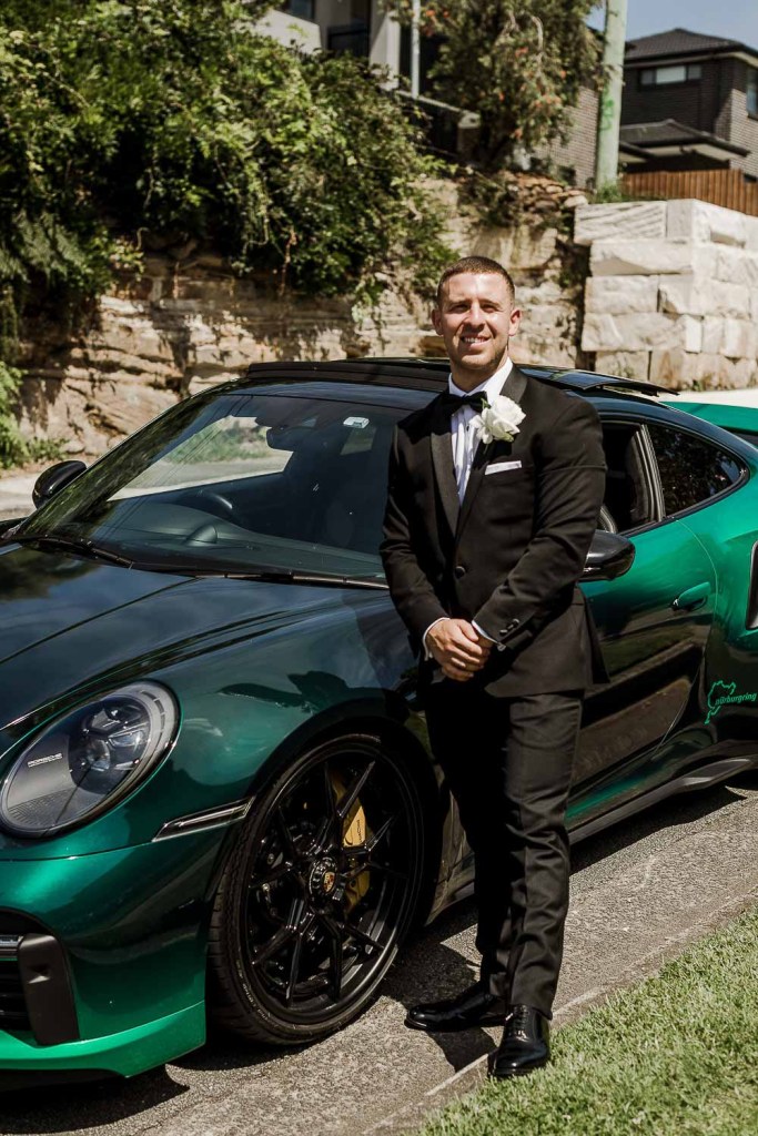 groom with his wedding car