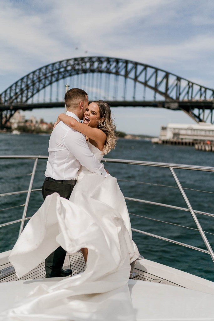 smiling couple and harbour bridge