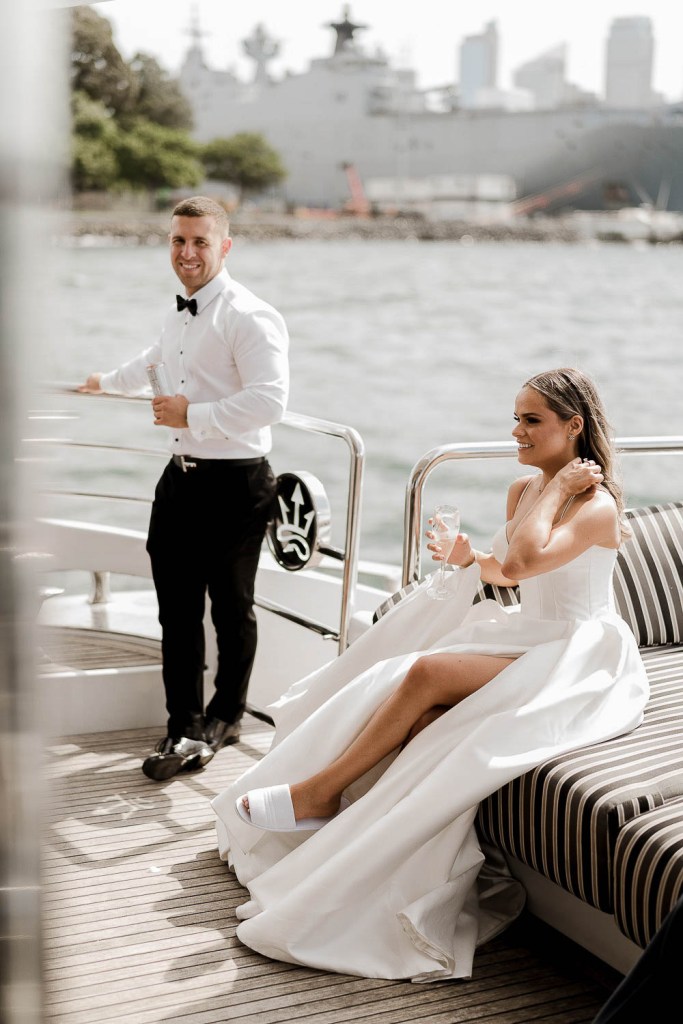 bride and groom glancing ahead on baot