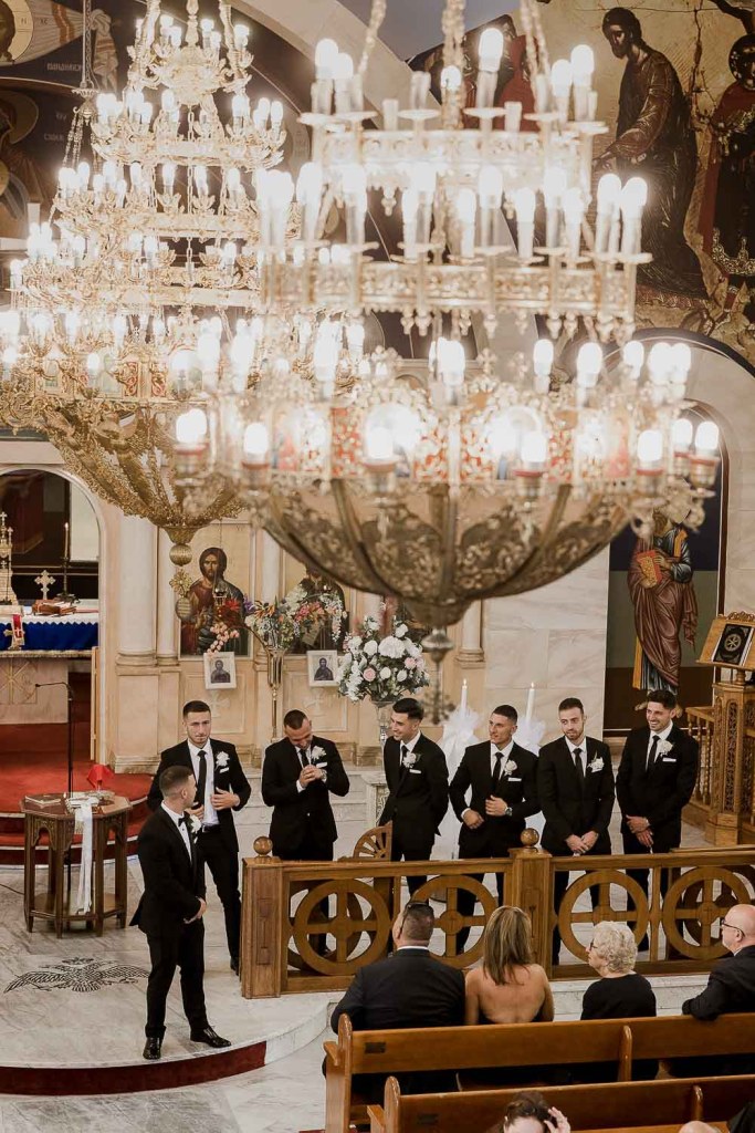 groomsman waiitng at front of church