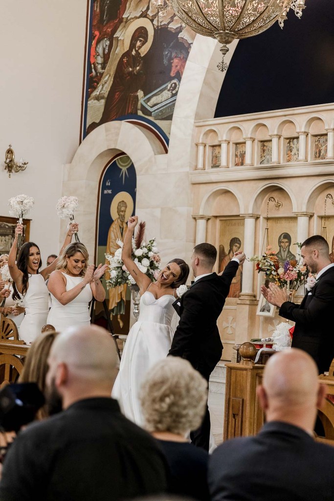 couple cheering at church