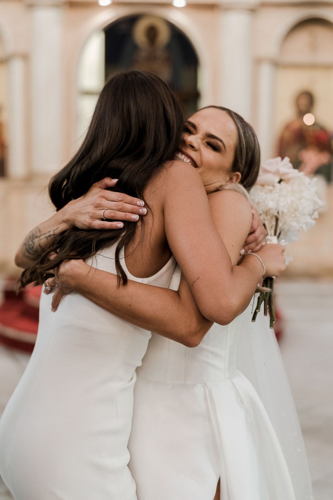 two women hugging closely